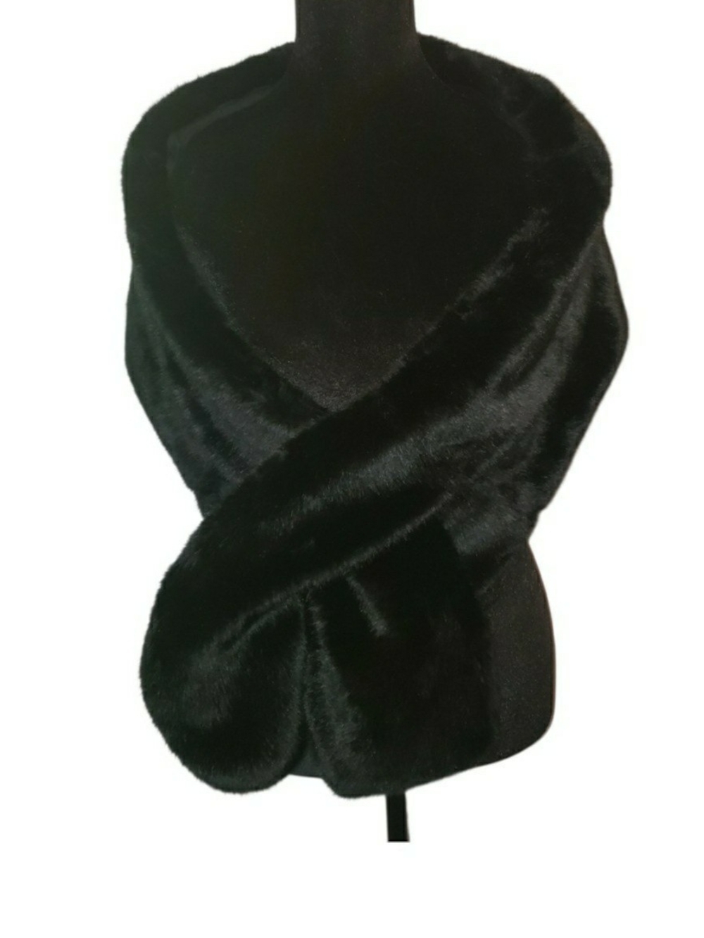 Elegant black faux fur wrap features a plush, high-pile texture. New